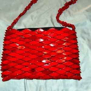 Red, wood bead crossbody. Unbranded.